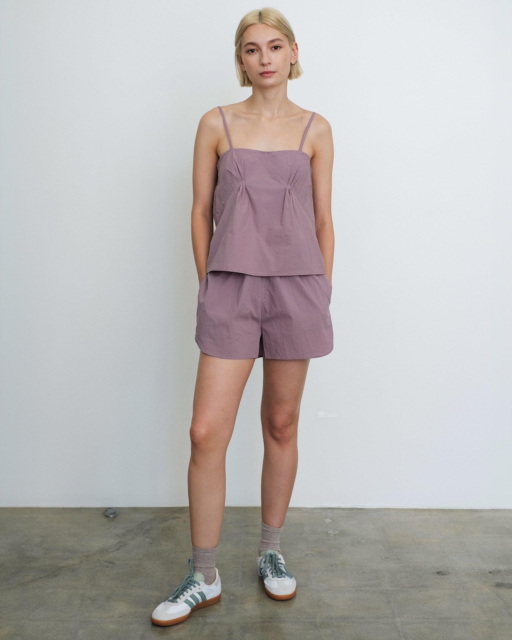 Model wears the Deiji Studios Pleat Set in Organic, Mauve Cotton Poplin 