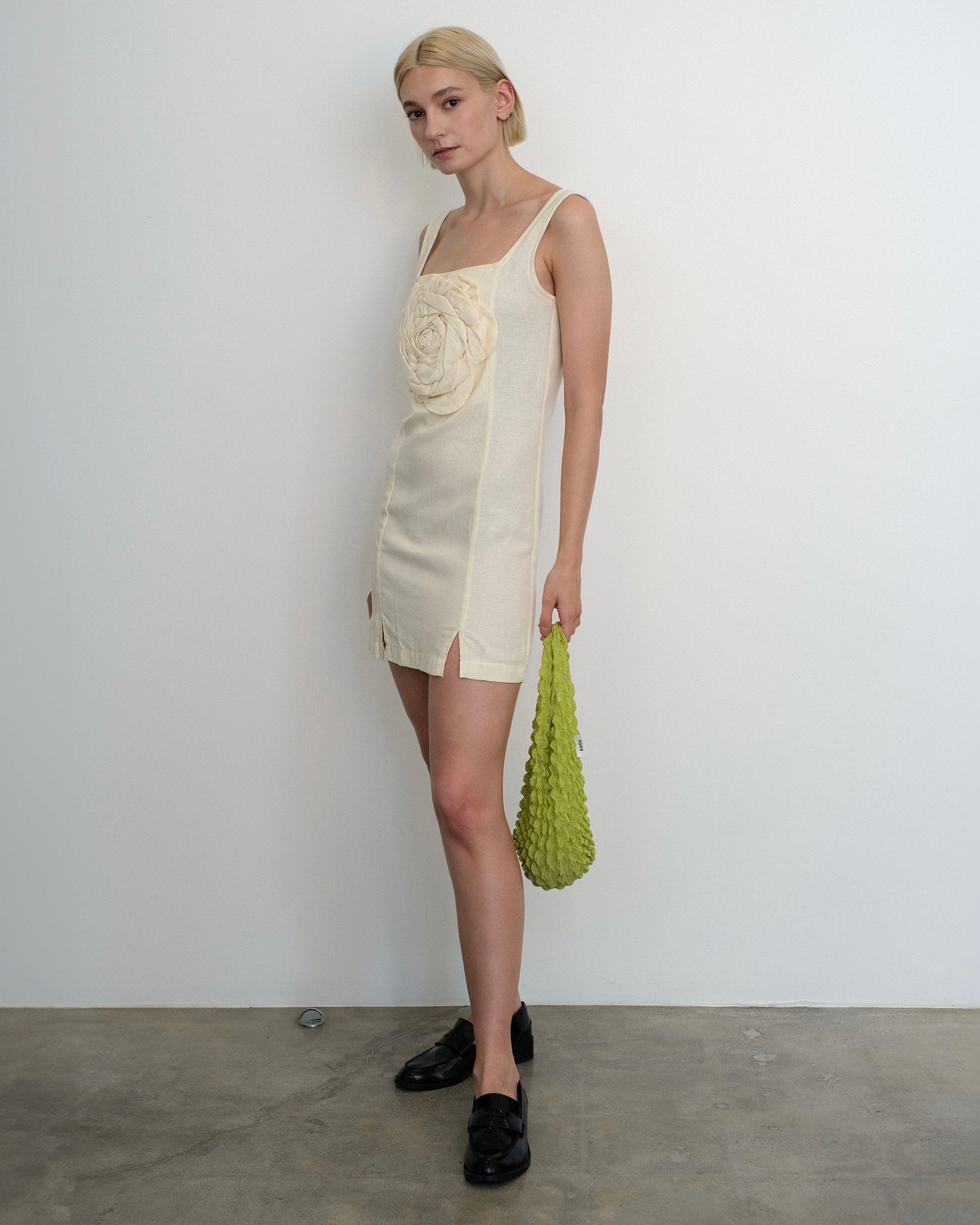 Model wearing the Marina Dress in ivory linen from Tach