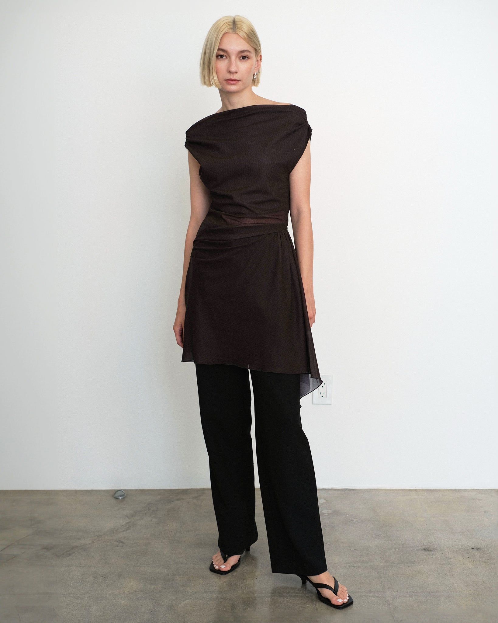 Model wearing Awen dress in sheer brown and black print from Una Hayde